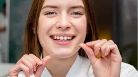 چند بار باید در روز نخ دندان بکشید ؟
